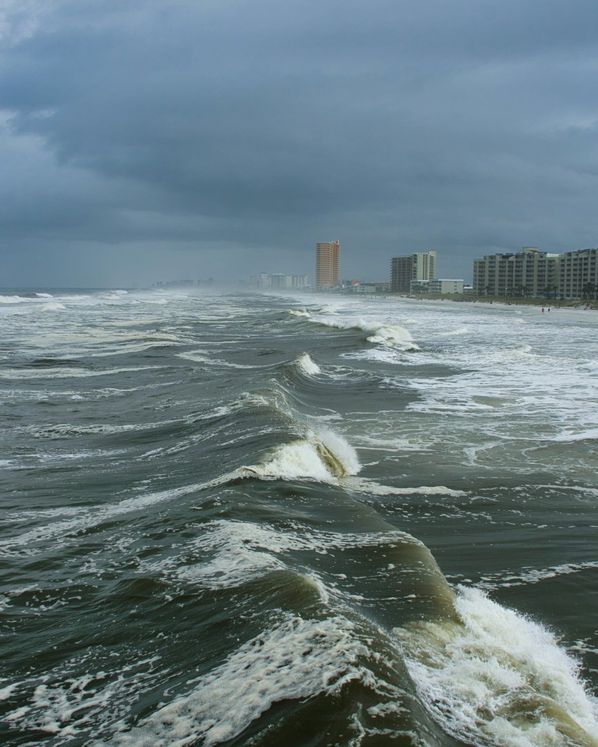 Storm-driven waves against a coastline, representing disaster recovery readiness