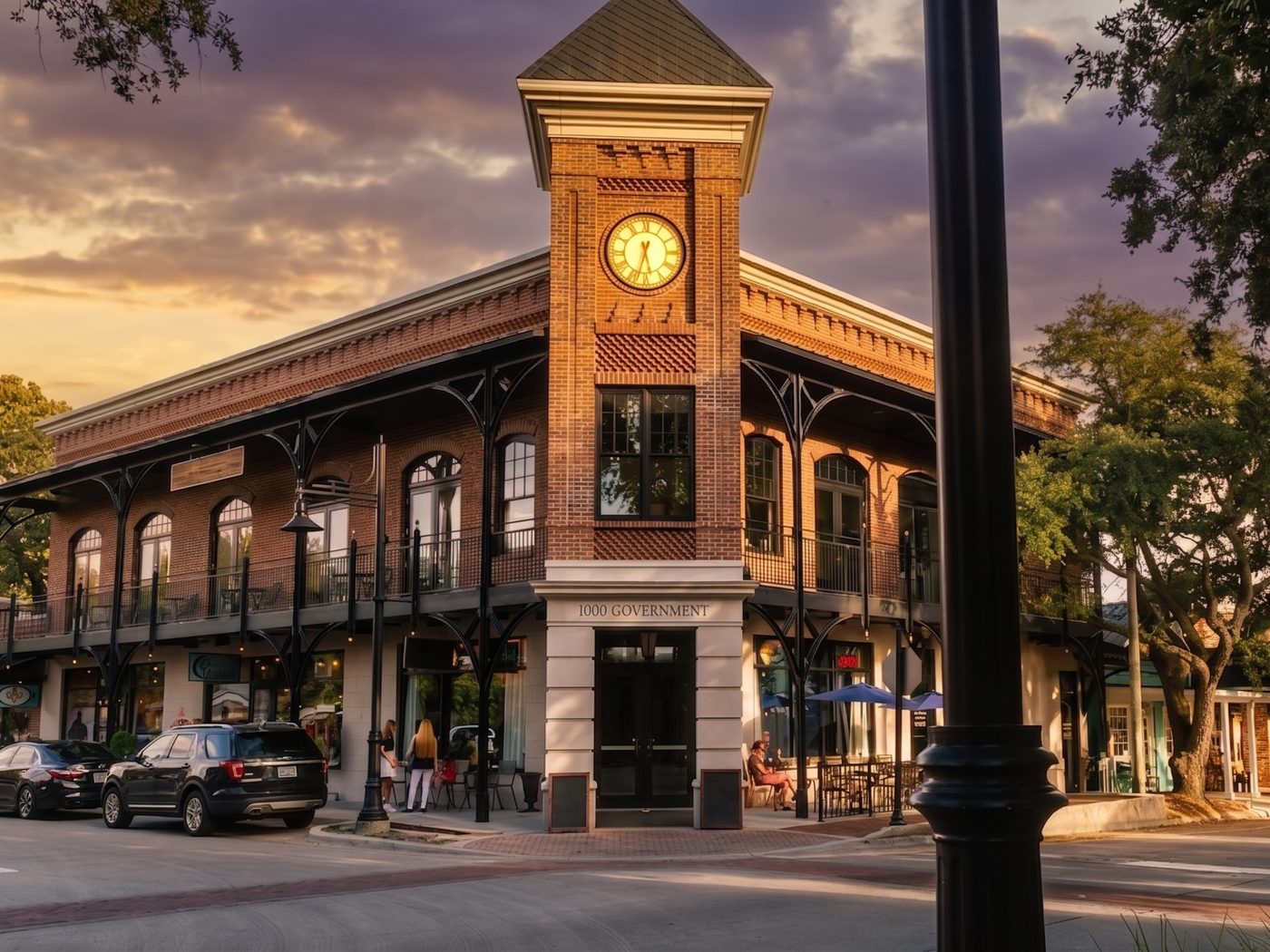 A historic downtown corner in Ocean Springs, Mississippi at sunset