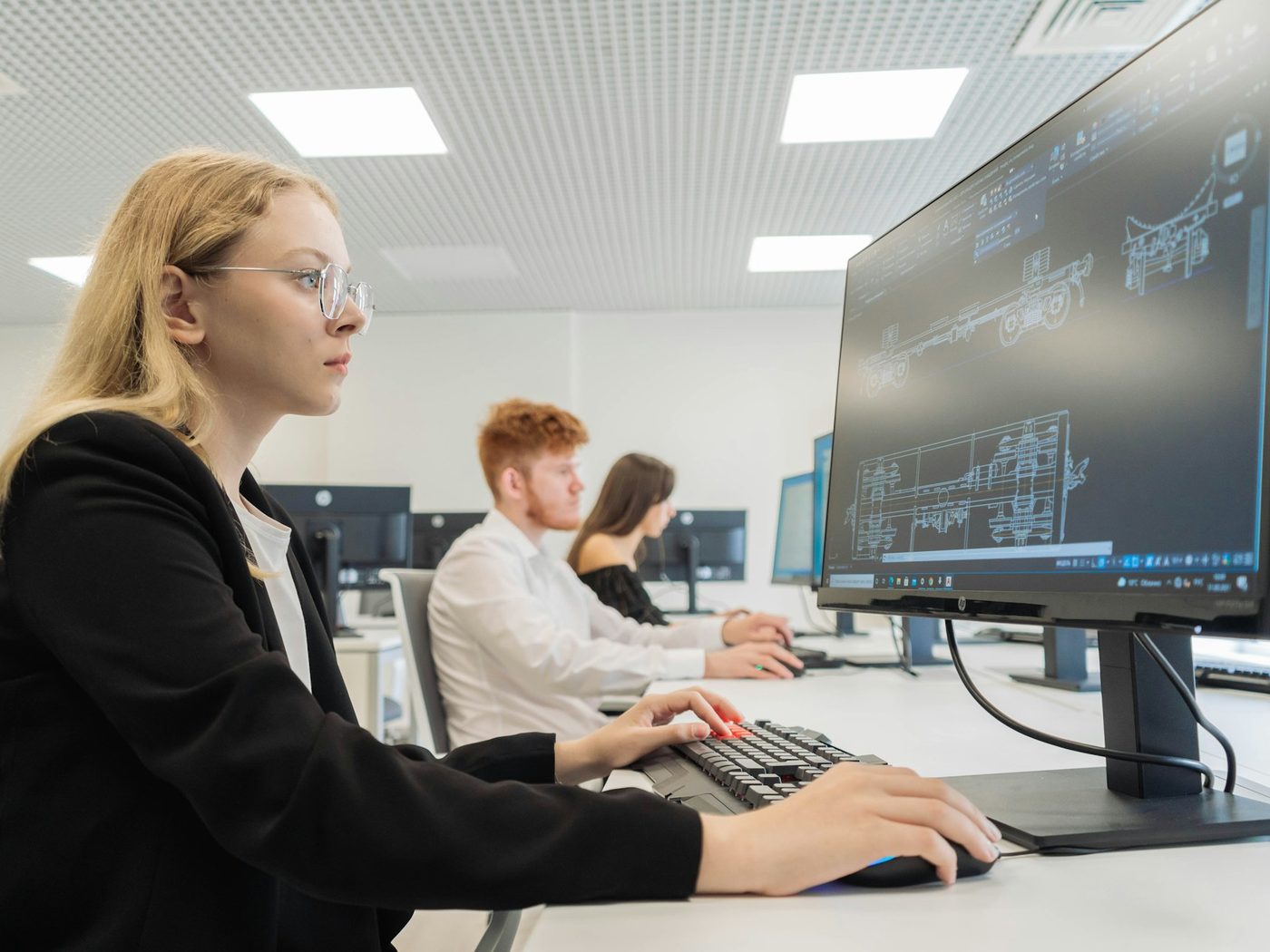 Professionals working at computer workstations in an office