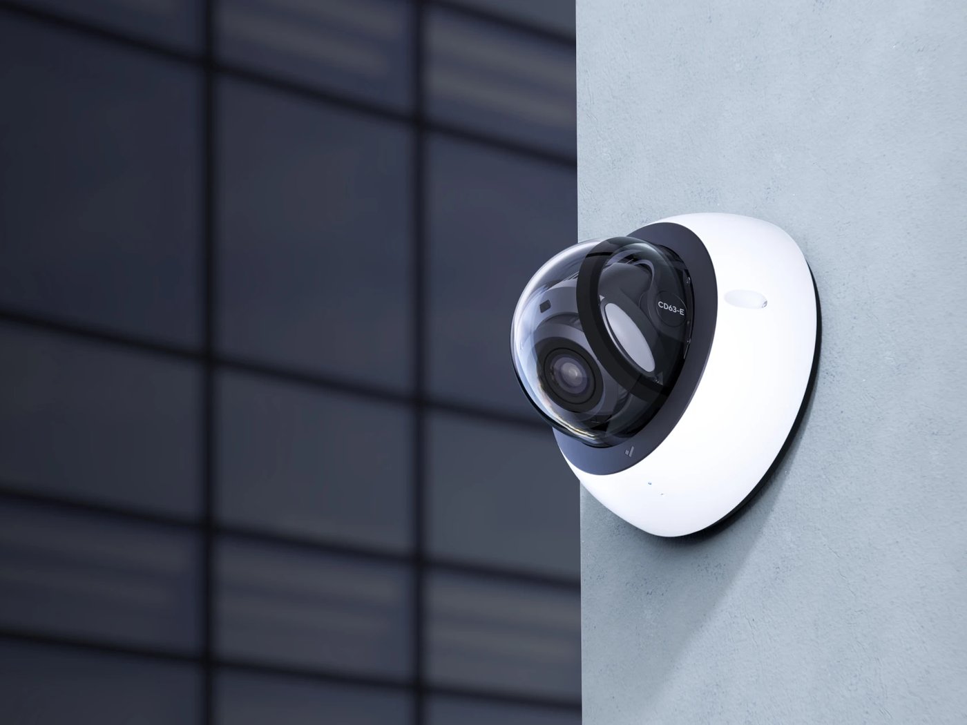 Dome security camera mounted on an office wall